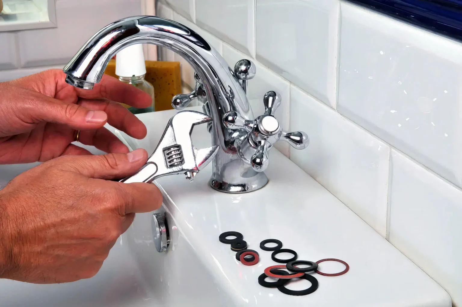 Plumber maintaining a bathroom faucet in Los Gatos