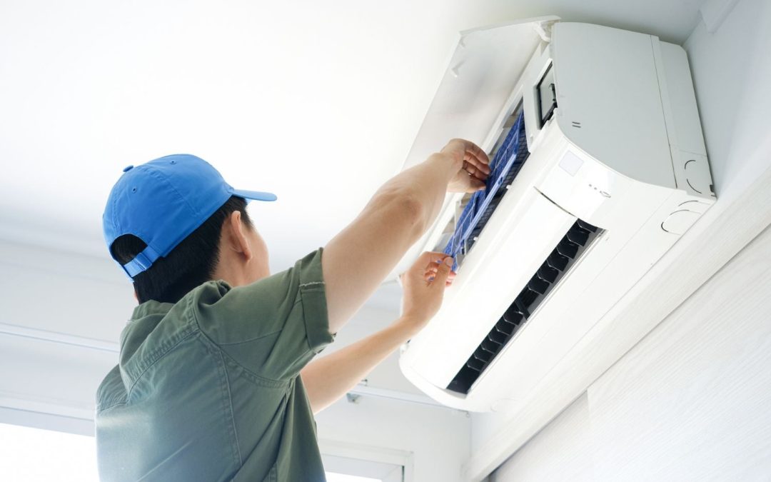 HVAC technician servicing a ductless mini split in Los Gatos
