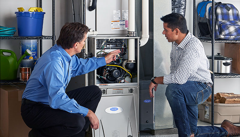 Technician evaluating a furnace for repair or replacement in Los Gatos