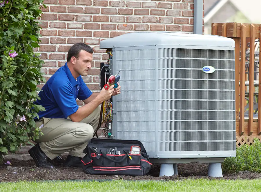 HVAC technician inspecting an outdoor AC unit in Los Gatos